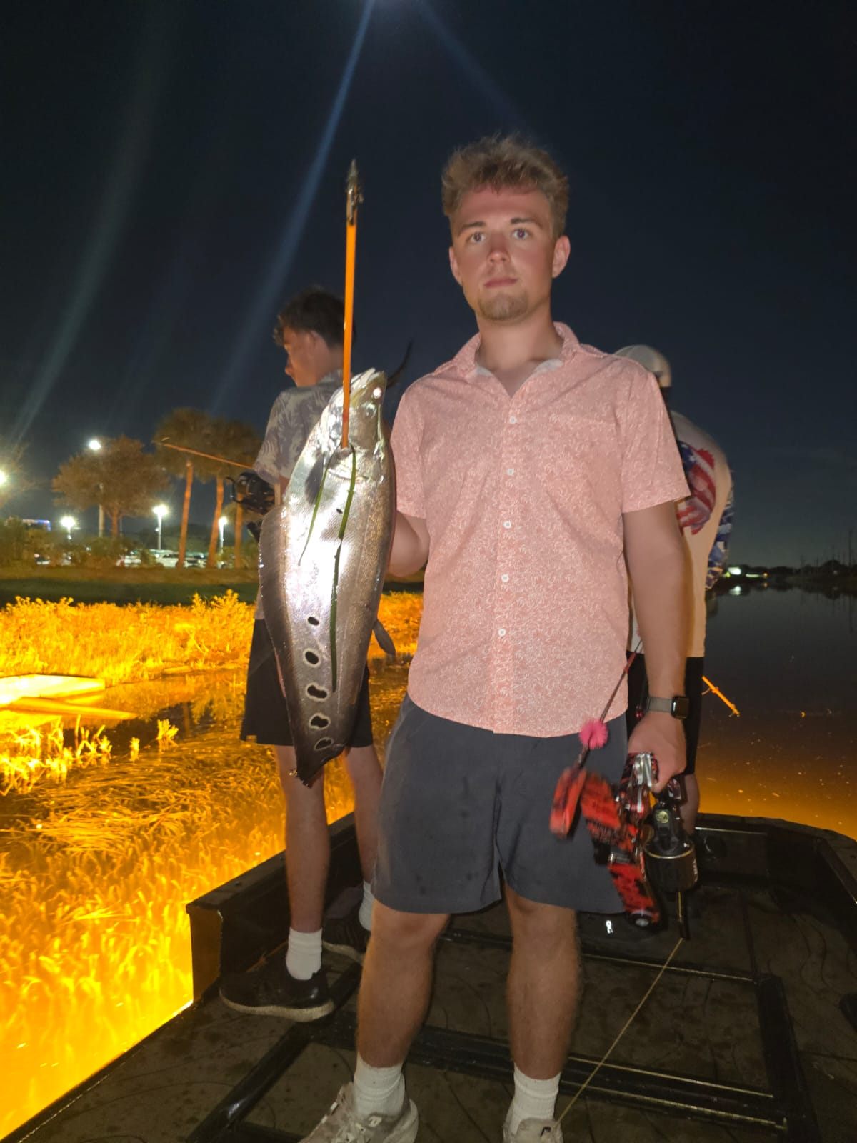 Native Roots Outdoors bowfishing trip photo with guests, fish, boat lights, and South Florida water