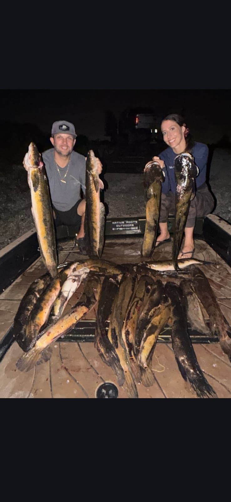 Native Roots Outdoors bowfishing trip photo with guests, fish, boat lights, and South Florida water