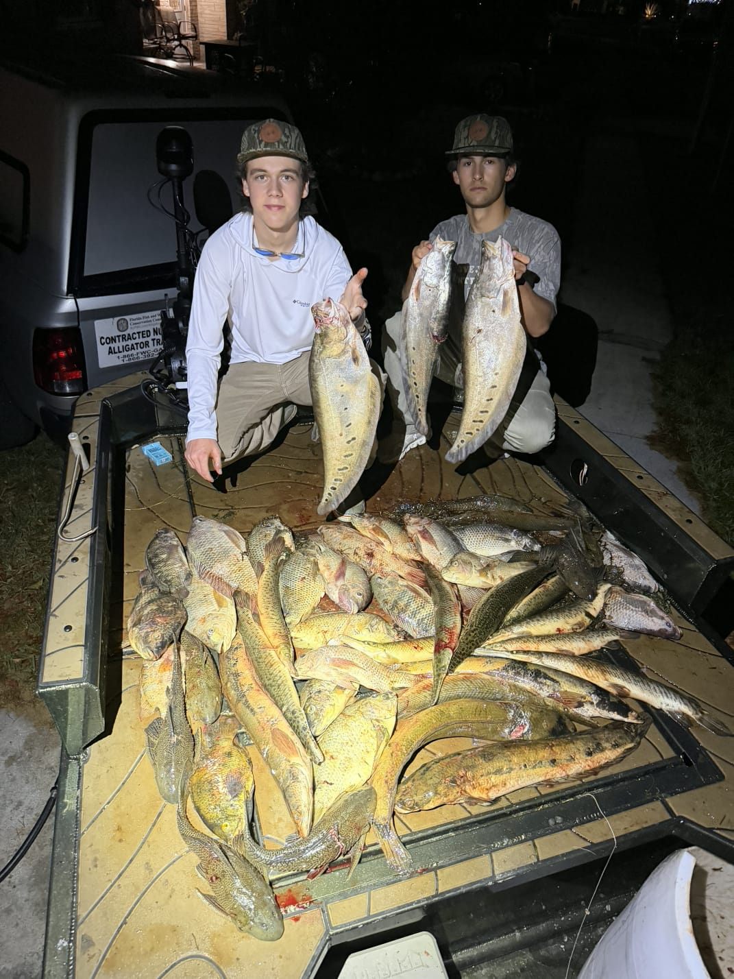 Native Roots Outdoors bowfishing trip photo with guests, fish, boat lights, and South Florida water