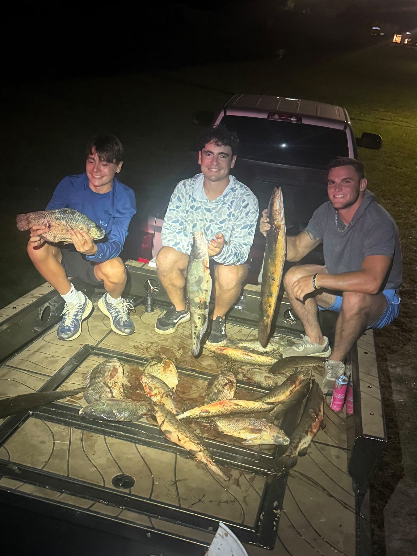 Native Roots Outdoors bowfishing trip photo with guests, fish, boat lights, and South Florida water