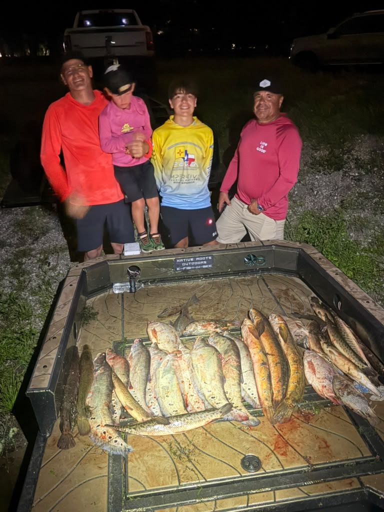 Native Roots Outdoors bowfishing trip photo with guests, fish, boat lights, and South Florida water