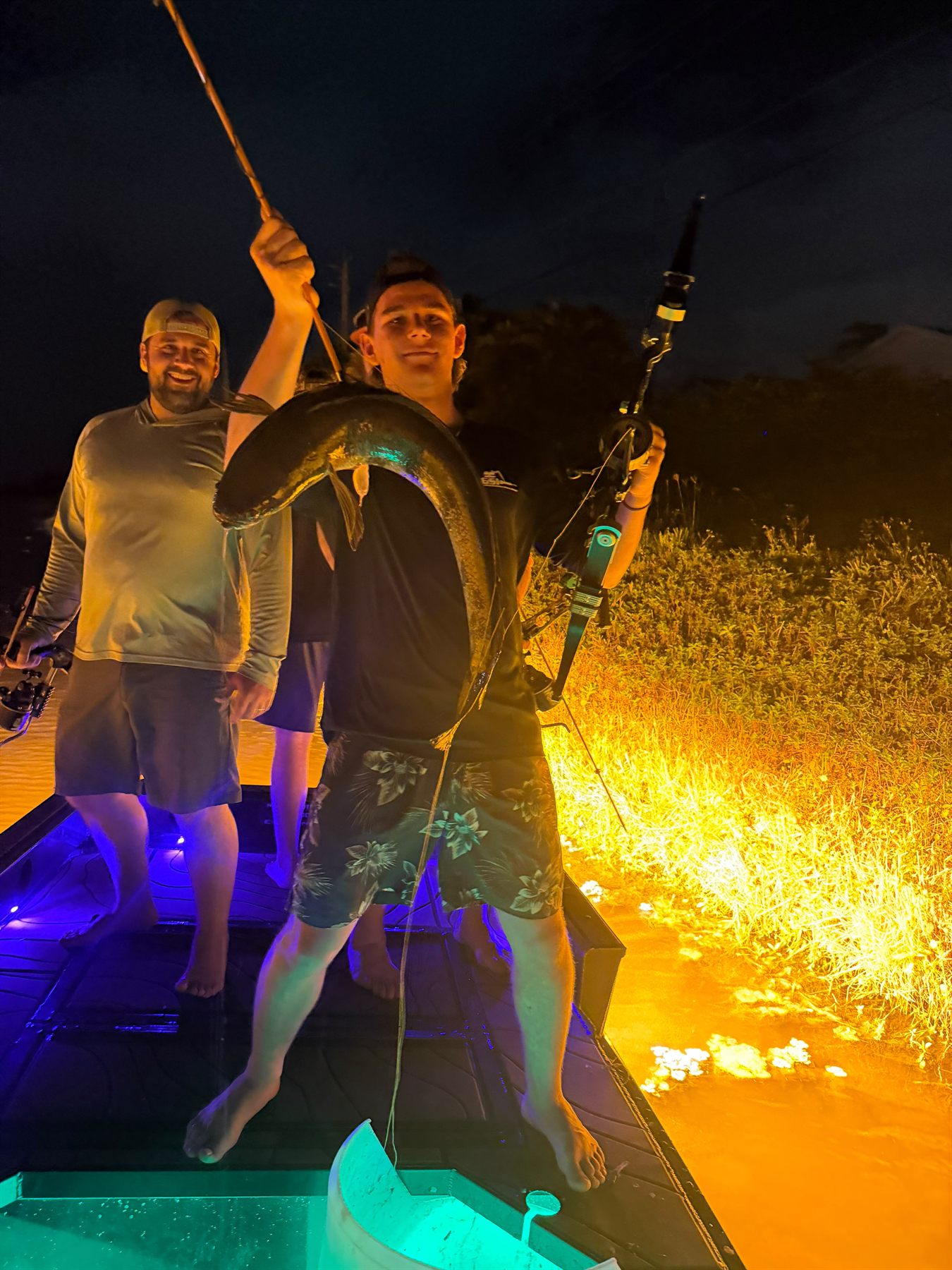 Native Roots Outdoors bowfishing trip photo with guests, fish, boat lights, and South Florida water