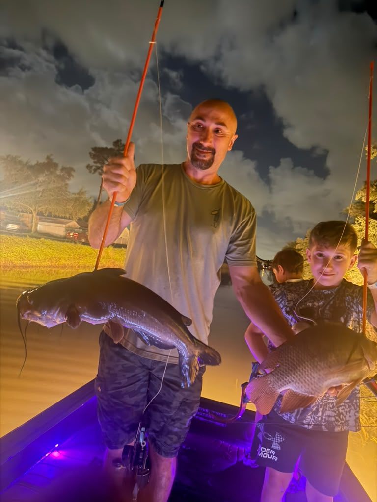 Native Roots Outdoors bowfishing trip photo with guests, fish, boat lights, and South Florida water
