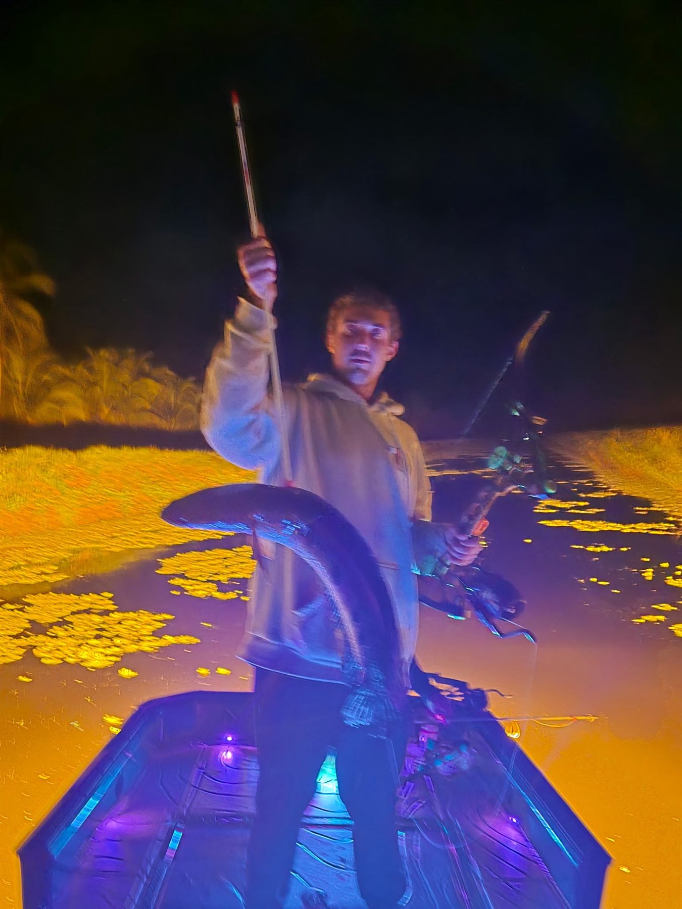 Native Roots Outdoors bowfishing trip photo with guests, fish, boat lights, and South Florida water